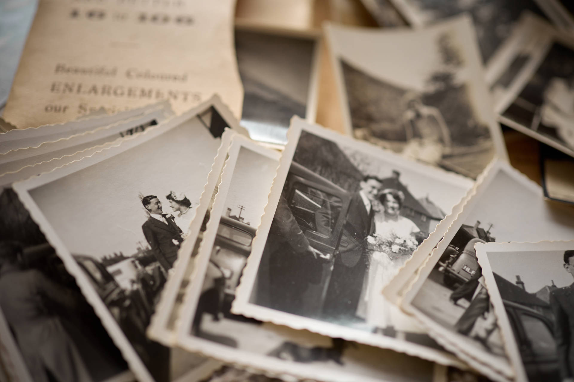 Old square black and white photographs from the 1950s ready to be scanned and digitised